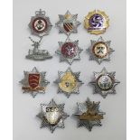 A selection of vintage chromed and enamelled fire service cap badges. To include: Hertfordshire Fire