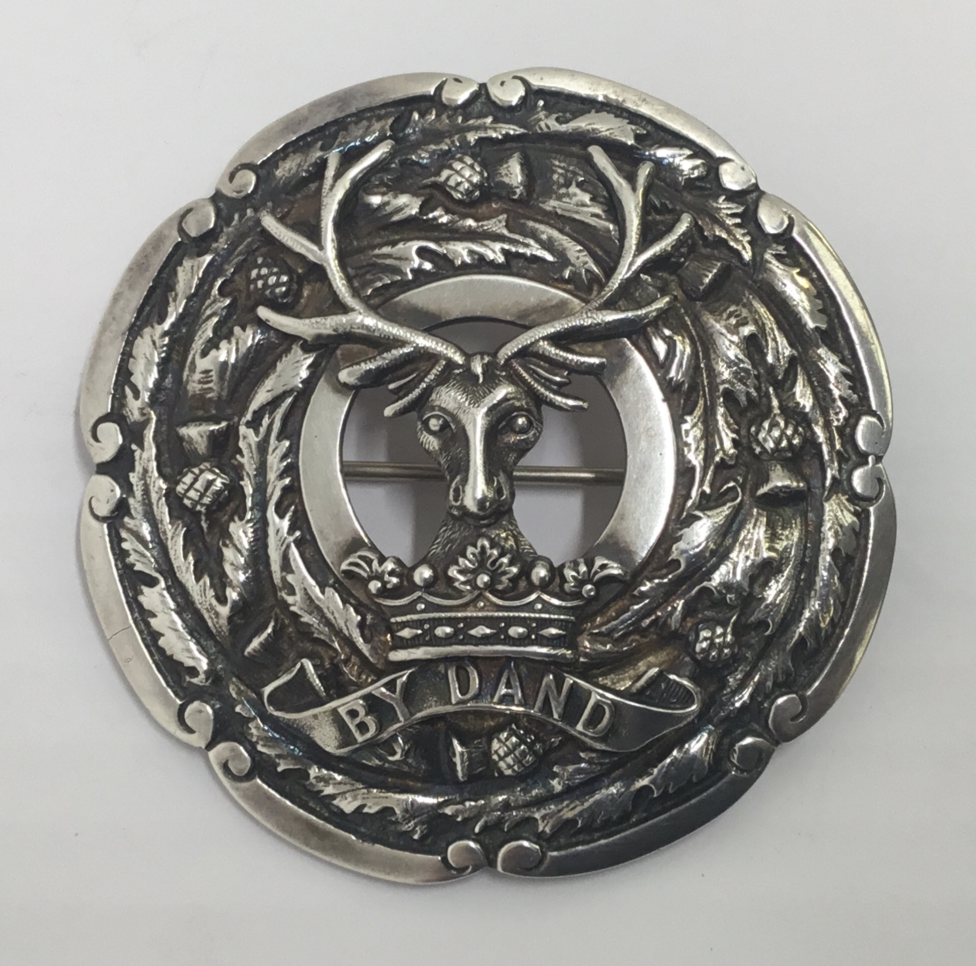 A good quality and heavy gauge, cast silvered (or possibly unmarked solid silver) Gordon Highlanders