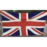 A large sized vintage Union Jack flag (with some calling it a Union Flag if not on a Royal Navy