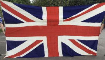 A large sized vintage Union Jack flag (with some calling it a Union Flag if not on a Royal Navy