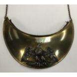 A 19th century French gilt brass gorget, with silvered eagle, black broadcloth backing, and neck