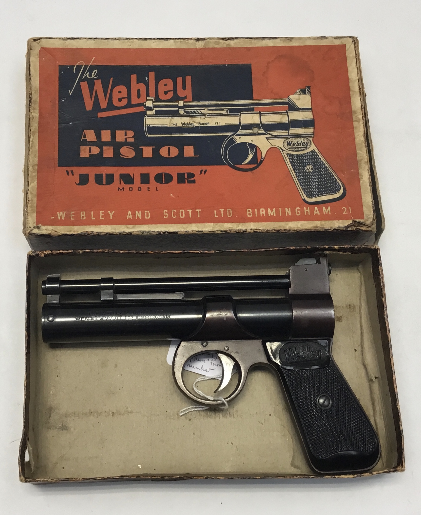 ‘Plum' colour Webley Junior over-lever air pistol in .177 with original box. This item is an example