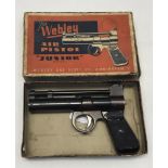 ‘Plum' colour Webley Junior over-lever air pistol in .177 with original box. This item is an example