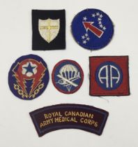 A selection of WW2 British and American embroidered patches. To include: a US Airborne Garrison