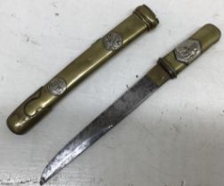 A Japanese Tanto Dagger with brass handle and scabbed decorated with silver plaques depicting