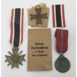 3 WW2 German medals. To include: the War Merit Cross with Sword, a War Merit Cross without Swords,