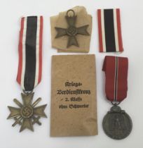 3 WW2 German medals. To include: the War Merit Cross with Sword, a War Merit Cross without Swords,