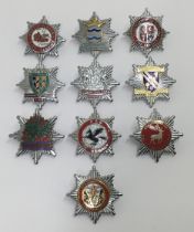 A selection of vintage chromed and enamelled fire service cap badges. To include: Nottinghamshire,