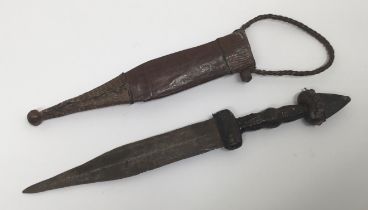 A late 19th / early 20th century Central African arm knife. Double edged blade with spear point,
