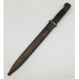A pre WW2 German K98 bayonet, dated 1938 to the spine of the blade. Complete with wooden slab grips,