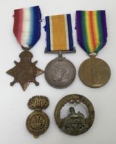 A WW1 1914 Star trio, and cap badge, awarded to 13260 Pte Ernest Bidmead of the South Wales