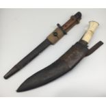 A WW2 era Indian SMLE bayonet, with scabbard and webbing frog. Marked GRI with a crown at the