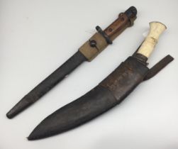 A WW2 era Indian SMLE bayonet, with scabbard and webbing frog. Marked GRI with a crown at the