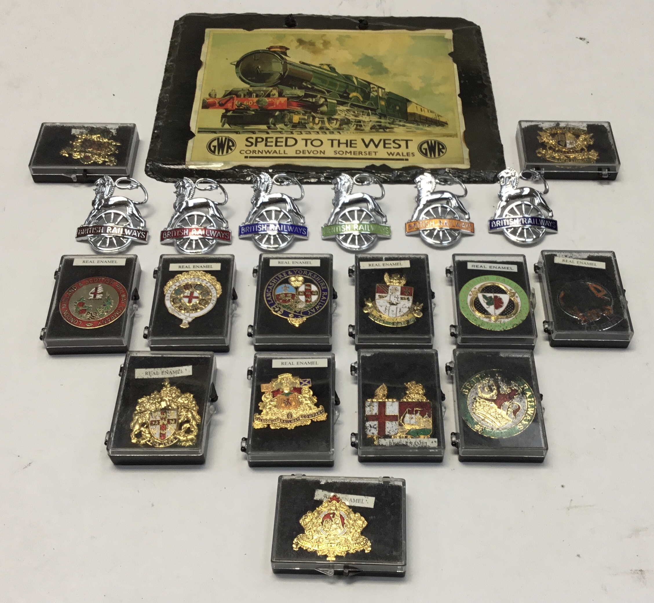 A selection of chromed and enamelled British Railways totem style cap badges, with different