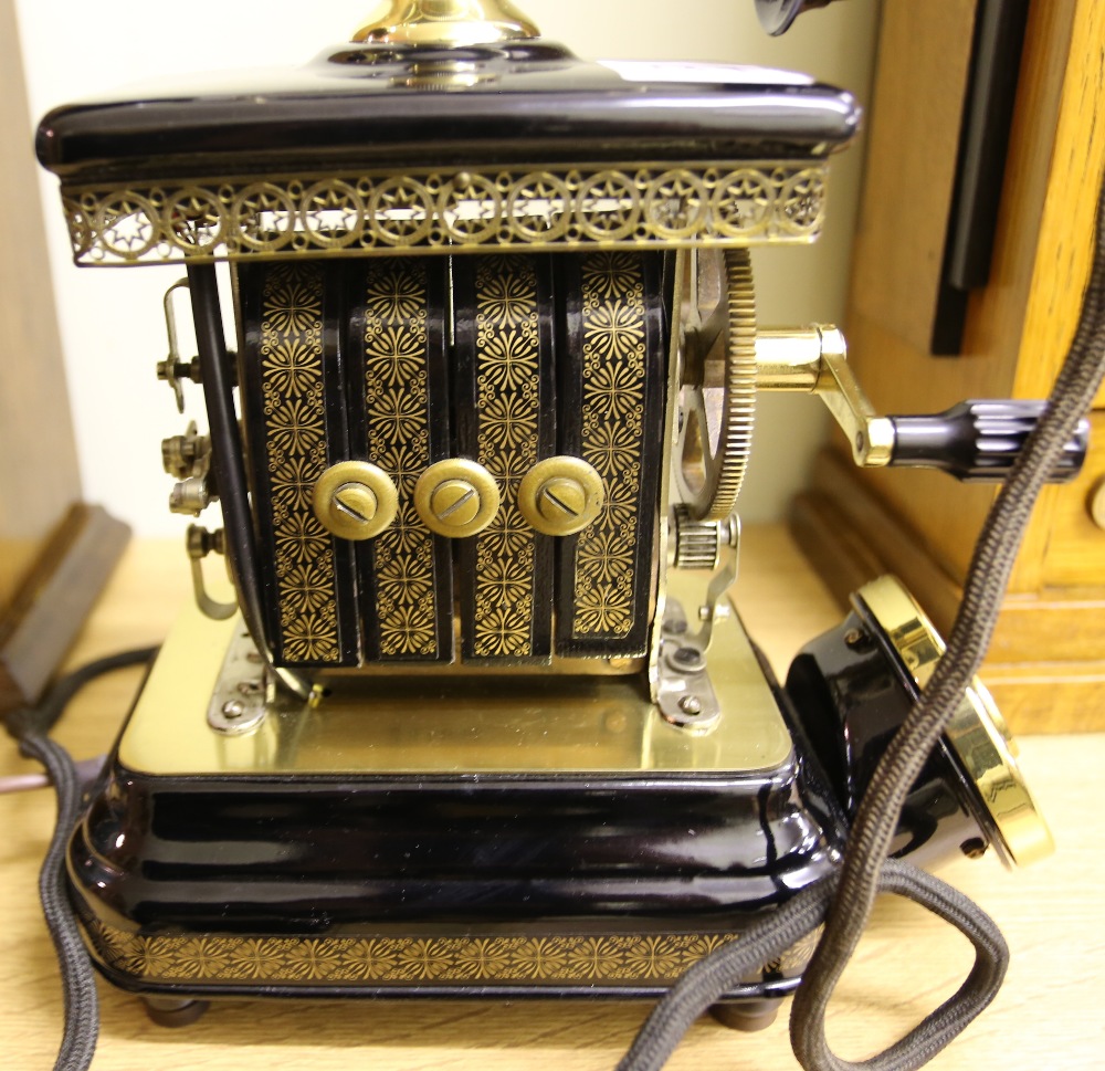 A 20th century ornate crank telephone, Expoga, Denmark with black enamel and gilt decoration. Please - Image 3 of 6