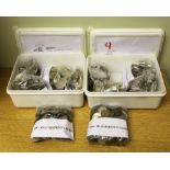 A collection of old sixpence coins used for amusement machines. Two small boxes. Please note: All