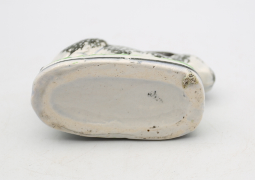 A Staffordshire pottery Rabbit crouched on an oval base, black sponged markings,  with green and - Image 5 of 5