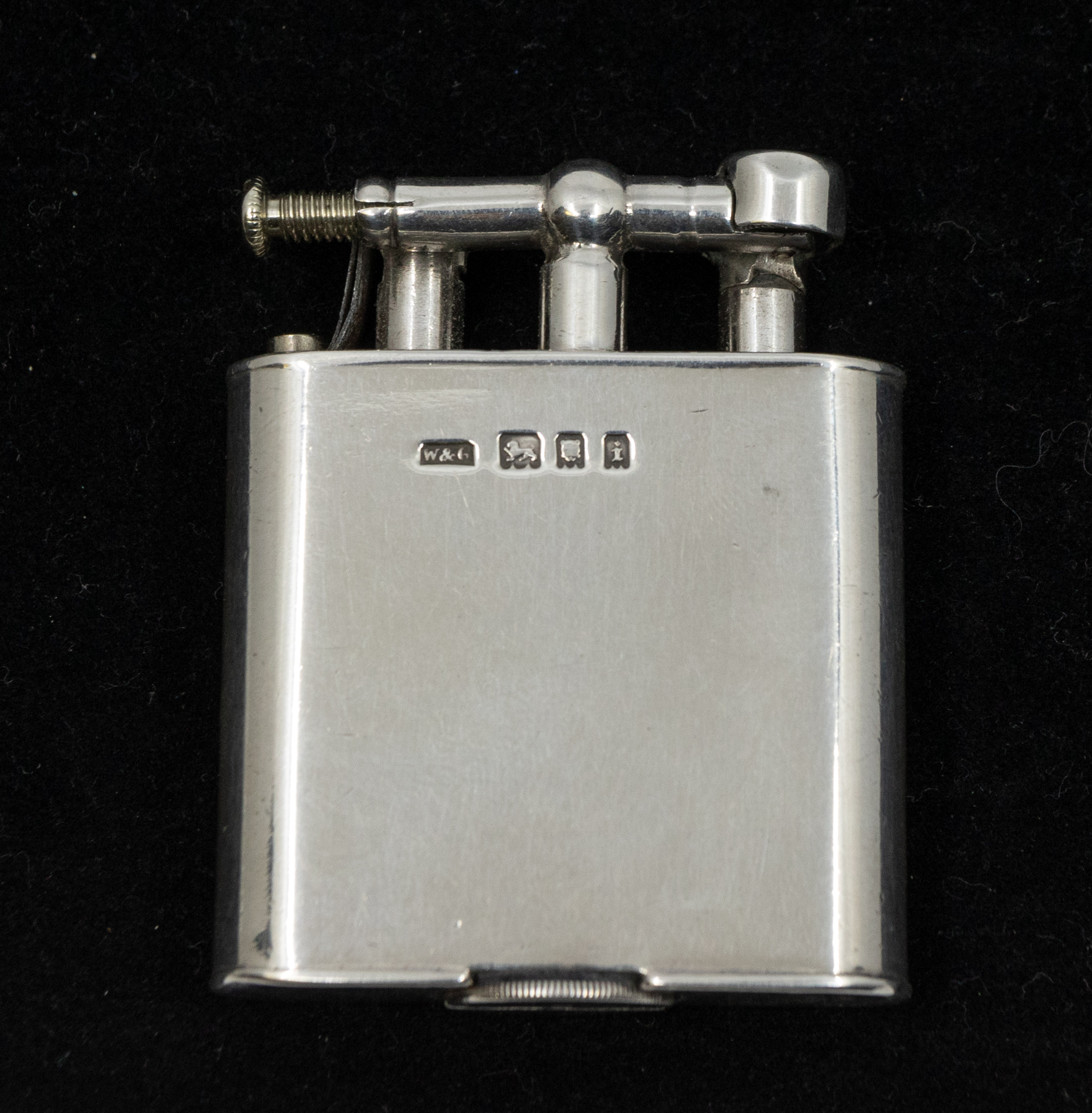 A George V silver lighter, of oval shape with plain design, hallmarked by  Wagner & Gerstley Ltd, - Image 2 of 3