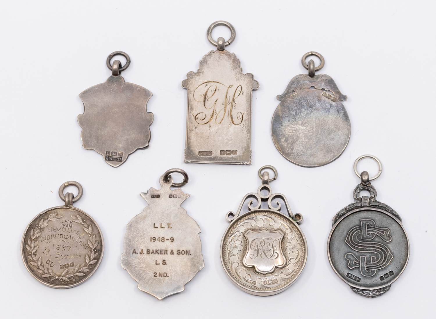 A collection of seven assorted silver hallmarked sporting fobs, to include: Tug of War, boxing, - Image 2 of 2