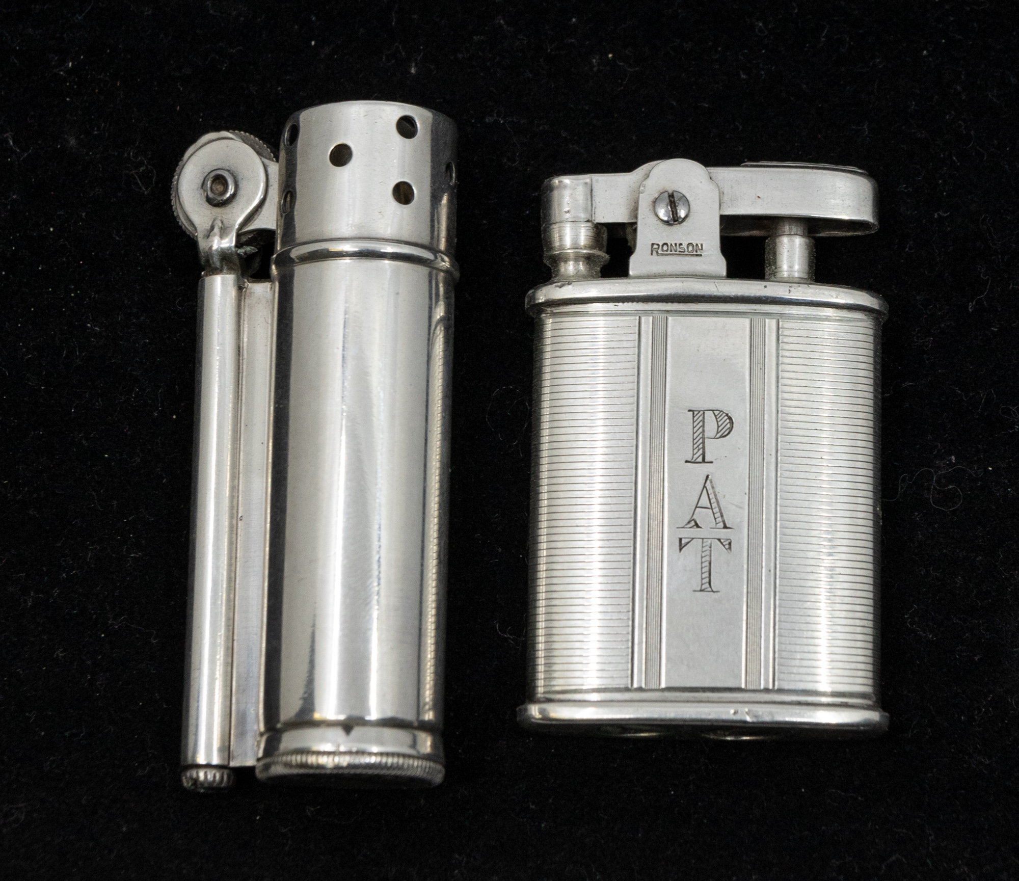 A sterling silver Dunhill service lighter of cylindrical form, marked to base and marked sterling to