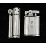 A sterling silver Dunhill service lighter of cylindrical form, marked to base and marked sterling to