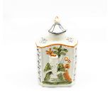 A Prattware tea caddy and cover with ‘macaroni ‘ figures moulded to the body. Decorated in green,