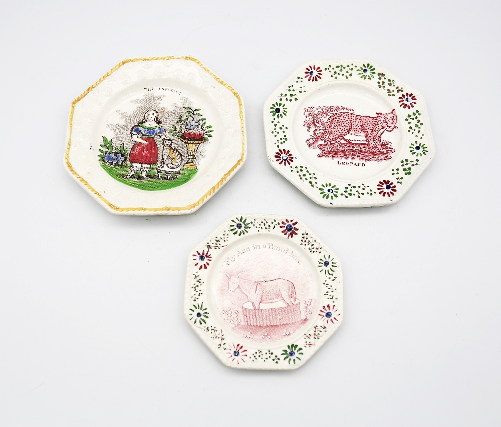 Three 19th century creamware child’s plates, with various prints, The Favorite, The Leopard  and
