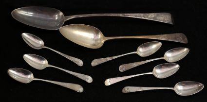 A group of early 19th Century Old English Pattern silver flatware to include: a large basting /