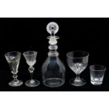 A late 18th Century/early 19th Century clear glass decanter with ribbed neck and original stopper
