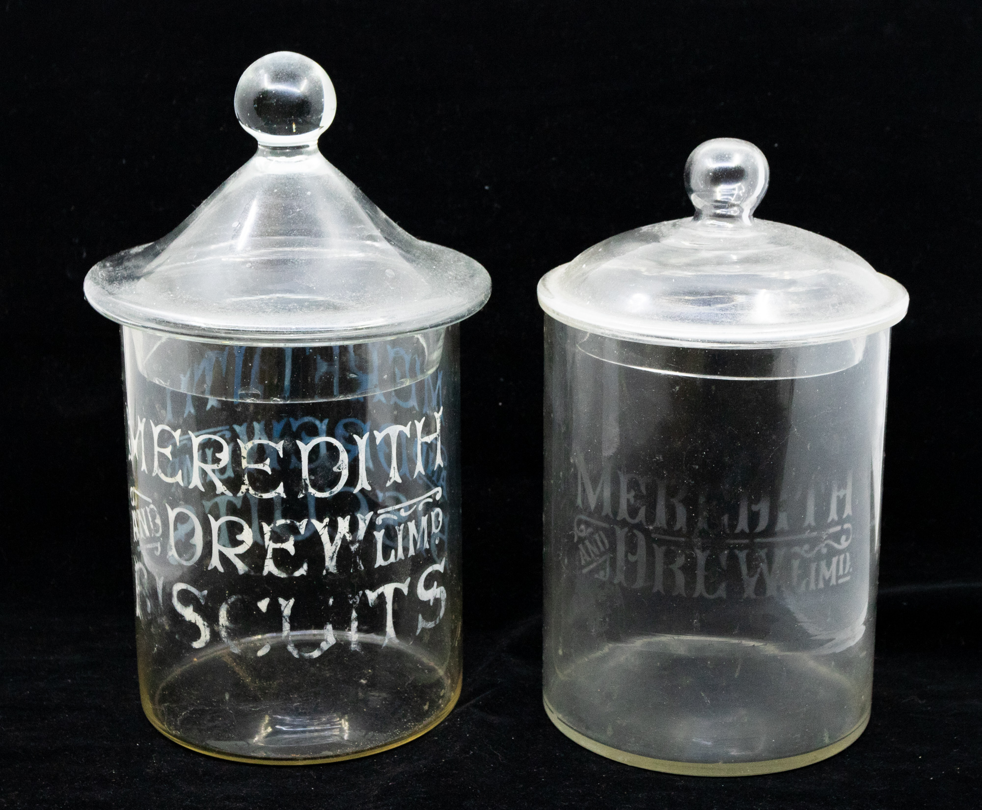 A collection of early 20th Century glass advertising jars, four in all, three with lids, Meredith - Image 2 of 5