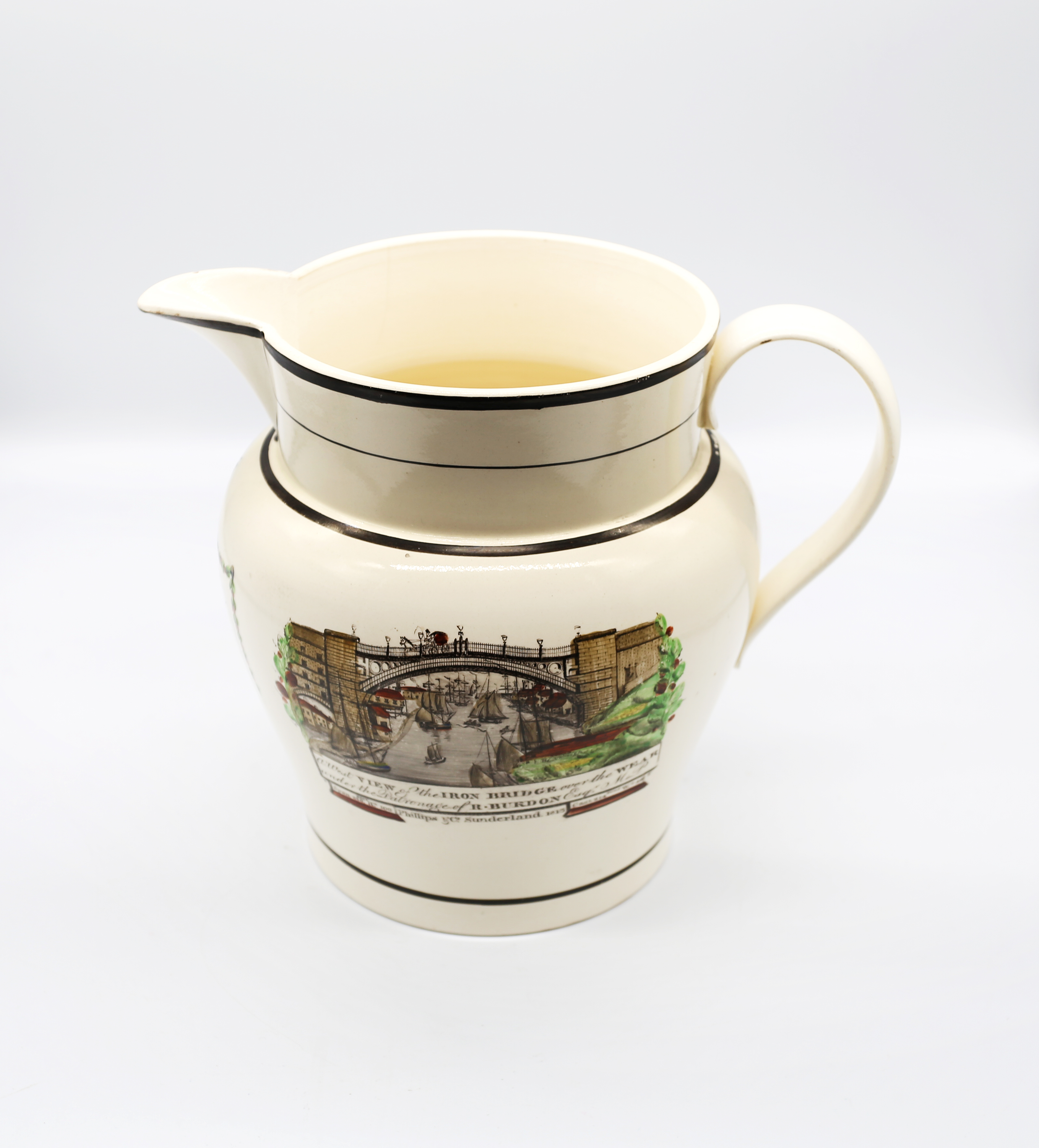 A Sunderland large creamware jug, depicting  ‘A West View of the Iron Bridge over the Wear’ to one