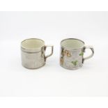 Two silver lustre mugs. One with yellow flowers and green leaves and an engine turned mug with