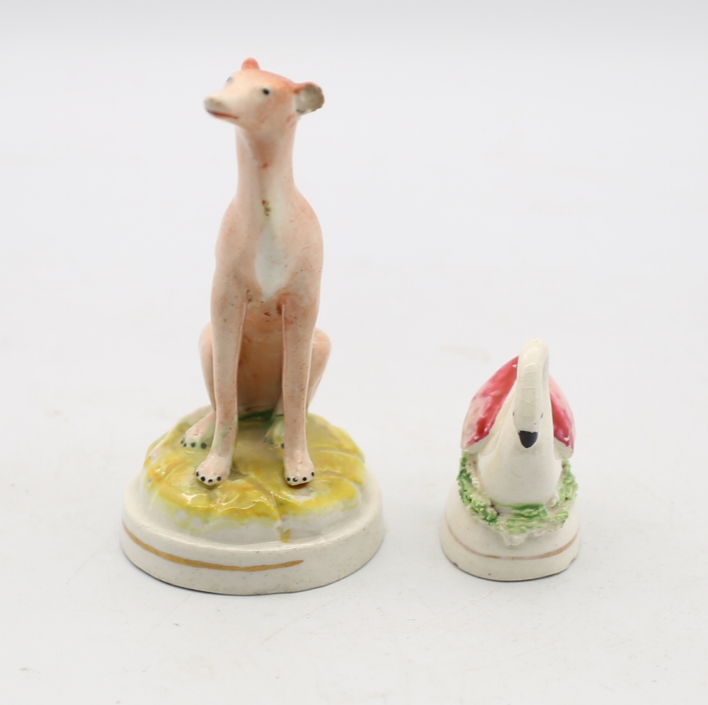 A Small Staffordshire pottery Whippet sitting a a round green base with a gilt band, along with a - Image 2 of 5