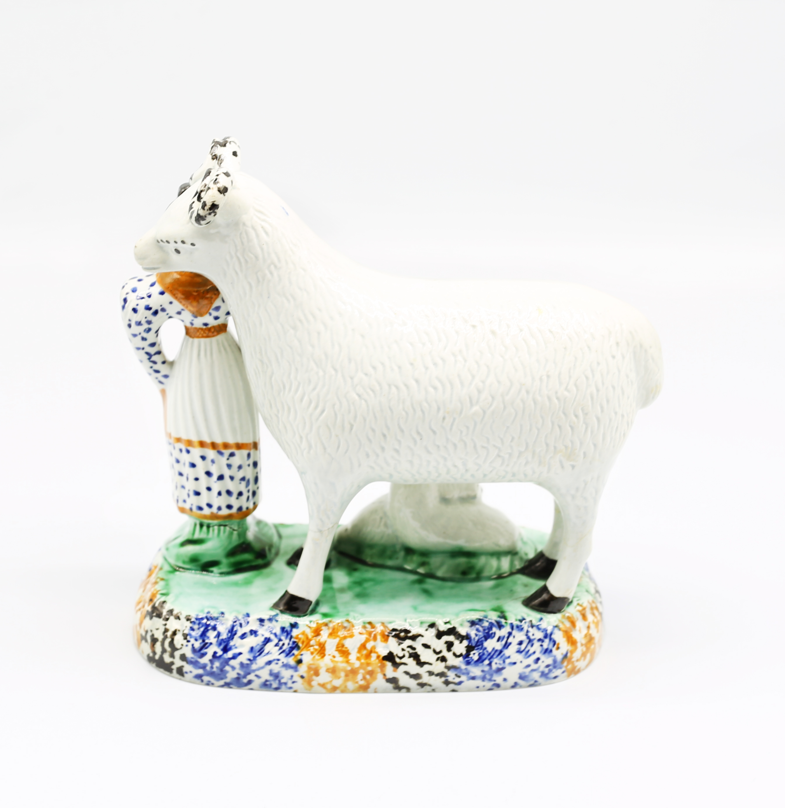 A Prattware model of a sheep and her lambs laying beneath her, with a shepherdess standing to the - Image 3 of 15