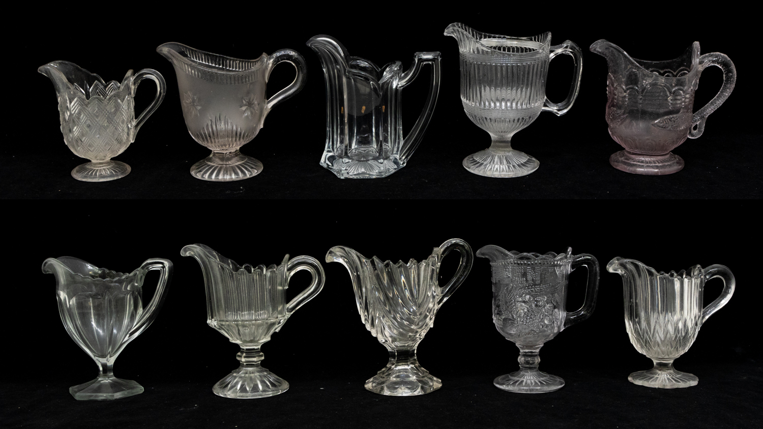 A collection of 19th Century moulded glass cream jugs.
