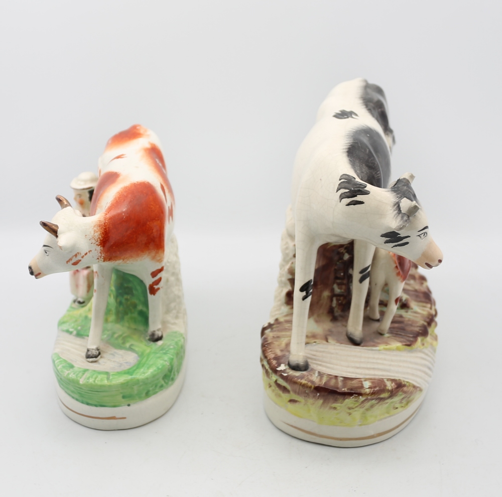 A Victorian Staffordshire pottery Cow and suckling calf standing on a grassy mound by a brook, along - Image 2 of 5