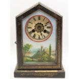An early 20th century Union Clock Company wooden cased mantel clock, front hinged door with