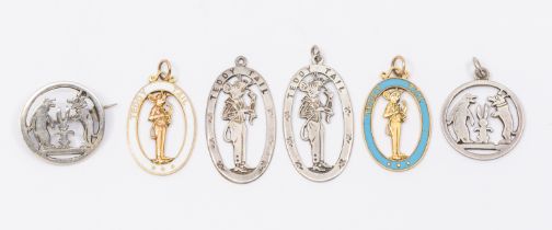 A collection of novelty 20th century gold or silver 'Teddy Tail' pendant charms to include; two