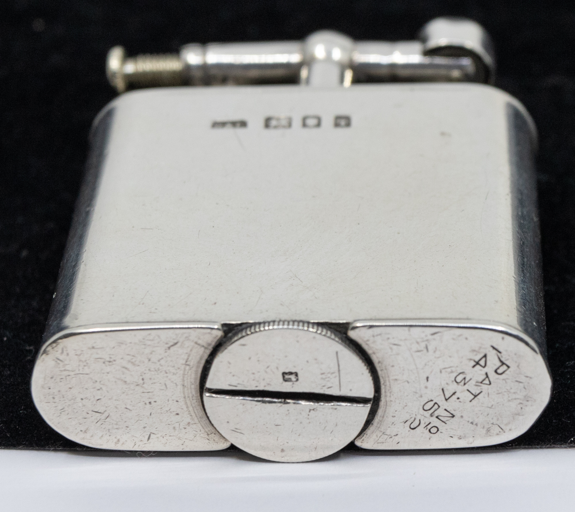 A George V silver lighter, of oval shape with plain design, hallmarked by  Wagner & Gerstley Ltd, - Image 3 of 3