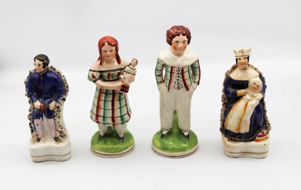 A pair of Staffordshire figures of Victoria & Albert along with a pair of North Country figures of a