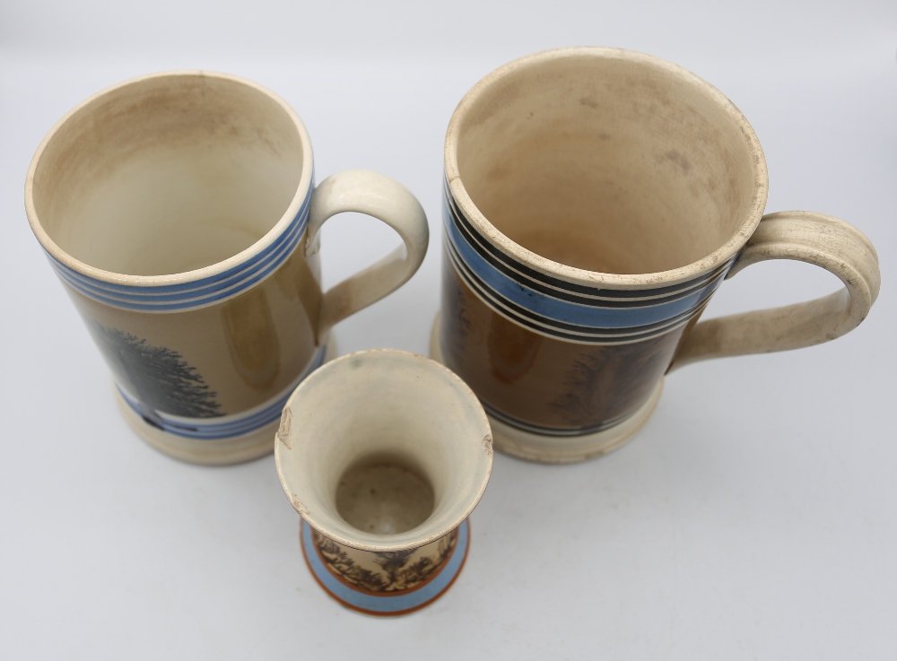 A Mocha ware Quart sized mug, mid brown ground with feathered sepia trees, blue band and six black - Image 5 of 6