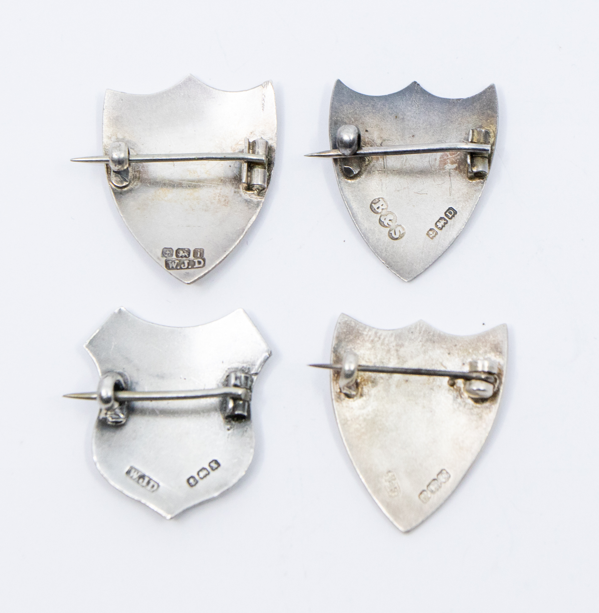 A collection of shield shaped silver pin badges, all with enamelled decoration to include: tennis - Image 2 of 2