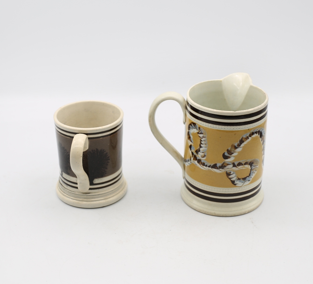 A small Mocha ware mug, grey ground with black feathered trees and black bands, along with a Mocha - Image 2 of 6