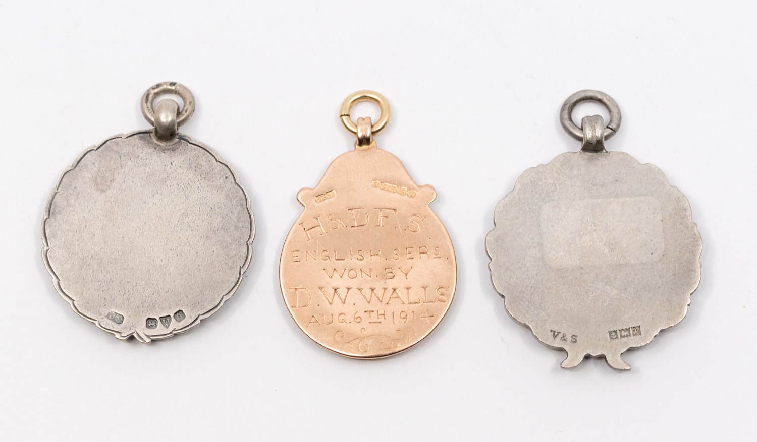 Three early to mid 20th century silver or gold and enamel fob medals, all with enamelled rabbit - Image 2 of 2