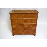 A Biedermeier four-drawer chest in birch veneer on pine frame, complete with key