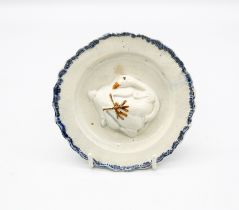 A pearlware ‘Toy’ round plate with a goose moulded in the centre with a blue feathered border.