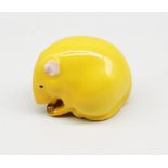 A Royal Worcester netsuke modelled as a mouse with nut in hands, yellow colourway, early to mid 20th