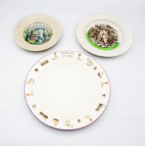 Three  19th/20th century children’s plates.  A child’s drawing plate, an alphabet plate with a print