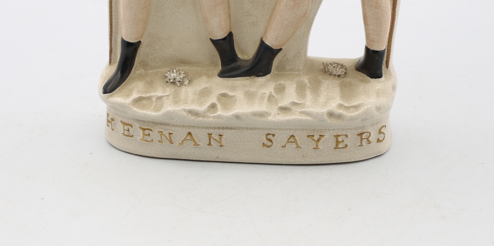 A reproduction Staffordshire white and gilt figure of Heenan and Sayers standing on an oval base. - Image 5 of 6