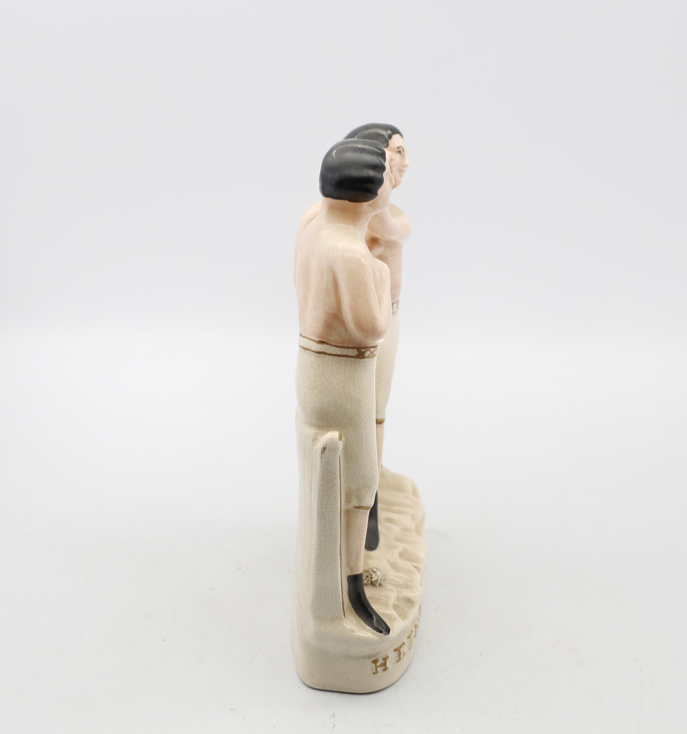 A reproduction Staffordshire white and gilt figure of Heenan and Sayers standing on an oval base. - Image 2 of 6